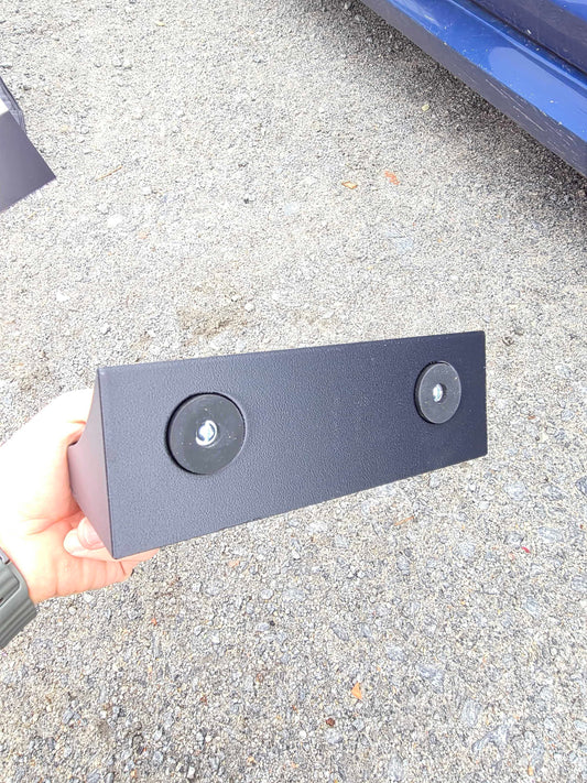 Baksidan av verktygshållaren med två gummiklädda magneter